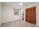 Bedroom with a window, closet with wooden doors, and an ensuite bathroom at 313 E Church St, Stanley, NC 28164