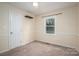 Bedroom with neutral carpet, a ceiling fan, and natural light through the window at 313 E Church St, Stanley, NC 28164