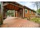 Wooden deck with an attached covered area and a ceiling fan at 313 E Church St, Stanley, NC 28164