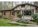 Attractive brick home with a covered front door and manicured landscaping at 313 E Church St, Stanley, NC 28164
