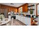 Updated kitchen featuring stainless steel appliances, black marbled countertops, and breakfast table at 313 E Church St, Stanley, NC 28164