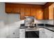 Kitchen with updated stainless steel oven, marbled countertops, and shaker cabinets at 313 E Church St, Stanley, NC 28164
