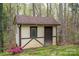 Exterior view of backyard shed with neutral paint and brown trim at 313 E Church St, Stanley, NC 28164