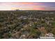 Overhead view featuring city skyline, established neighborhoods, and surrounding green spaces at 3433 Byrnes St, Charlotte, NC 28205