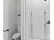 Clean and modern bathroom with a walk-in shower, sleek white tiles, and contemporary black fixtures at 3433 Byrnes St, Charlotte, NC 28205