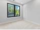 Bright bedroom features a modern window and plush carpet, creating a calming and inviting space at 3433 Byrnes St, Charlotte, NC 28205