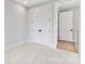 Bedroom featuring carpet flooring, fresh paint, and ample closet space at 3433 Byrnes St, Charlotte, NC 28205