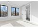 Light, bright bedroom features plush carpeting, large windows, and fresh paint at 3433 Byrnes St, Charlotte, NC 28205
