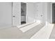 Bedroom with soft carpet, fresh paint and an attached, modern bathroom at 3433 Byrnes St, Charlotte, NC 28205