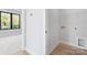 Walk-in closet featuring laminate wood flooring and ample shelf space at 3433 Byrnes St, Charlotte, NC 28205