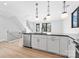 Open kitchen with stainless steel appliances, an island and modern lighting at 3433 Byrnes St, Charlotte, NC 28205