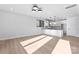 Open concept living room and kitchen offer seamless entertaining at 3433 Byrnes St, Charlotte, NC 28205