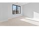 Bright bedroom featuring neutral carpet, white walls, and natural light at 3437 Byrnes St, Charlotte, NC 28205