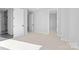 Bright bedroom with neutral carpet and view of an en suite bathroom at 3437 Byrnes St, Charlotte, NC 28205