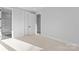 Spacious bedroom with neutral carpet, ensuite bathroom, and walk-in closet at 3437 Byrnes St, Charlotte, NC 28205