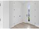 Bright foyer featuring modern white doors and light-colored flooring at 3437 Byrnes St, Charlotte, NC 28205