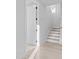 Bright hallway with stairs leading to the upper level and an open doorway at 3437 Byrnes St, Charlotte, NC 28205