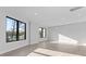 Spacious living room filled with natural light from black frame windows and contemporary flooring at 3437 Byrnes St, Charlotte, NC 28205