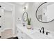 Modern bathroom with double vanity, sleek fixtures, and stylish decor with a large mirror at 3441 Byrnes St, Charlotte, NC 28205