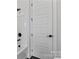 Clean bathroom featuring a white tub, modern fixtures, and a stylish paneled door at 3441 Byrnes St, Charlotte, NC 28205
