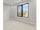 Bright bedroom with a large black-framed window offering pleasant outdoor views at 3441 Byrnes St, Charlotte, NC 28205