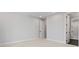 Minimalist bedroom with light carpet, recessed lights, and elegant paneled doors at 3441 Byrnes St, Charlotte, NC 28205
