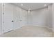 Neutral bedroom with plush carpeting, recessed lighting, and two stylish paneled doors at 3441 Byrnes St, Charlotte, NC 28205