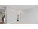 A bright, empty bedroom with neutral carpet and a doorway to an adjoining bathroom at 3441 Byrnes St, Charlotte, NC 28205
