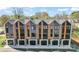 A row of modern townhouses showcasing unique architectural design and attached garages at 3441 Byrnes St, Charlotte, NC 28205