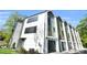 Modern townhouse with sleek lines, large windows, and a private garage at 3441 Byrnes St, Charlotte, NC 28205