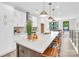 Open kitchen features a large island with barstool seating and modern white cabinetry at 3441 Byrnes St, Charlotte, NC 28205