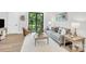 Inviting living room featuring stylish furniture and a large window with tree views at 3441 Byrnes St, Charlotte, NC 28205