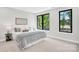 Serene bedroom featuring large windows, soft colors, and modern furnishings with natural light at 3441 Byrnes St, Charlotte, NC 28205