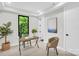 Modern office space featuring a stylish desk, chair, and a large window offering bright, natural light at 3441 Byrnes St, Charlotte, NC 28205
