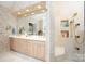 Bright bathroom showcasing double sinks, walk-in shower, and stylish tile work at 345 Porters Glen None, New London, NC 28127