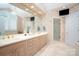 Well-lit bathroom with double vanity, glass-enclosed shower, and modern fixtures at 345 Porters Glen None, New London, NC 28127