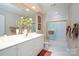 Nicely appointed bathroom featuring a large mirror, tile accents, white vanity, and glass shower door at 345 Porters Glen None, New London, NC 28127