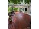 Spacious wooden deck with an umbrella and view provides ample outdoor living space at 345 Porters Glen None, New London, NC 28127