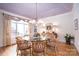 Formal dining room featuring an eye-catching chandelier and a large glass table for entertaining at 345 Porters Glen None, New London, NC 28127