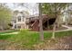 Beautiful exterior view of the home featuring a large, elevated deck and backyard at 345 Porters Glen None, New London, NC 28127
