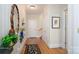 Inviting hallway featuring hardwood floors and elegant decorative accents at 345 Porters Glen None, New London, NC 28127