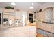 Bright kitchen boasts a center island, custom cabinets, and modern appliances, perfect for cooking enthusiasts at 345 Porters Glen None, New London, NC 28127
