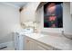 Well-equipped laundry room with washer, dryer, sink, and ample cabinet space at 345 Porters Glen None, New London, NC 28127