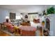 Bright and open living room with fireplace and a dining area at 345 Porters Glen None, New London, NC 28127