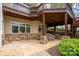 Charming stone patio with bench seating under a deck offers a relaxing outdoor space at 345 Porters Glen None, New London, NC 28127