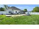 The house features a well-kept lawn, brick patio with Adirondack chairs, and a screened-in porch at 3701 Arthur St, Indian Trail, NC 28079