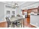 Open dining area with backyard access and view into an updated kitchen at 3701 Arthur St, Indian Trail, NC 28079