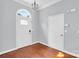 Beautiful foyer featuring hardwood floors, arched doorway and fresh paint at 3701 Arthur St, Indian Trail, NC 28079