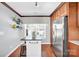 Charming kitchen with a center island, stainless steel refrigerator, and wood flooring at 3701 Arthur St, Indian Trail, NC 28079