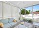 Relaxing sun room with screened windows, comfortable seating, and a view of the backyard at 3701 Arthur St, Indian Trail, NC 28079